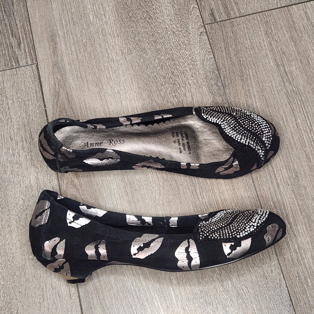 Black Leather Flats with Metallic Lip Print & Rhinestone Accent